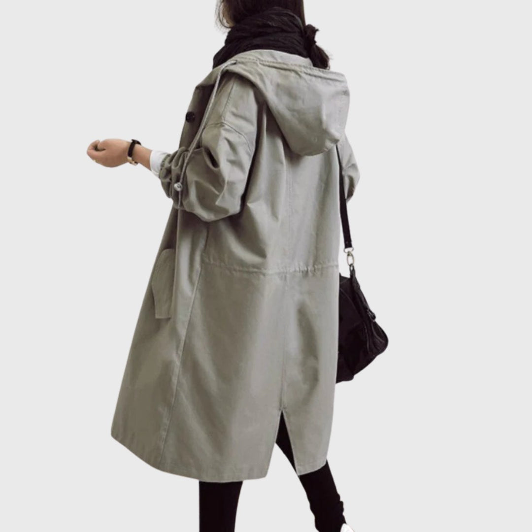 Essential fall & spring outerwear: women's water-resistant long hooded trench coat for chic weather protection.