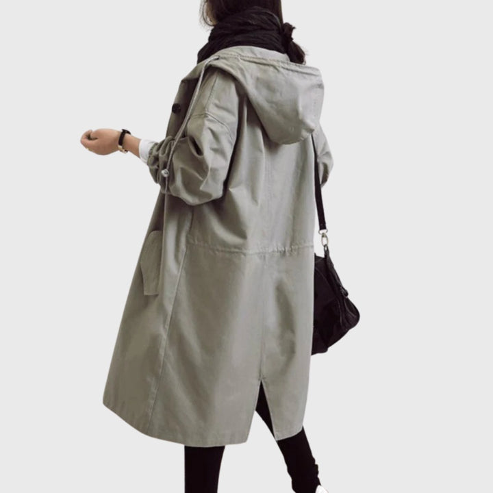 Essential fall & spring outerwear: women's water-resistant long hooded trench coat for chic weather protection.