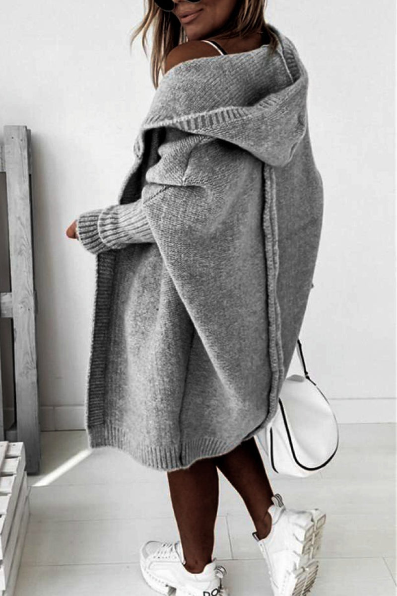 Relaxed fit women's knit hooded cardigan, ideal for cozy autumn layering and everyday wear.