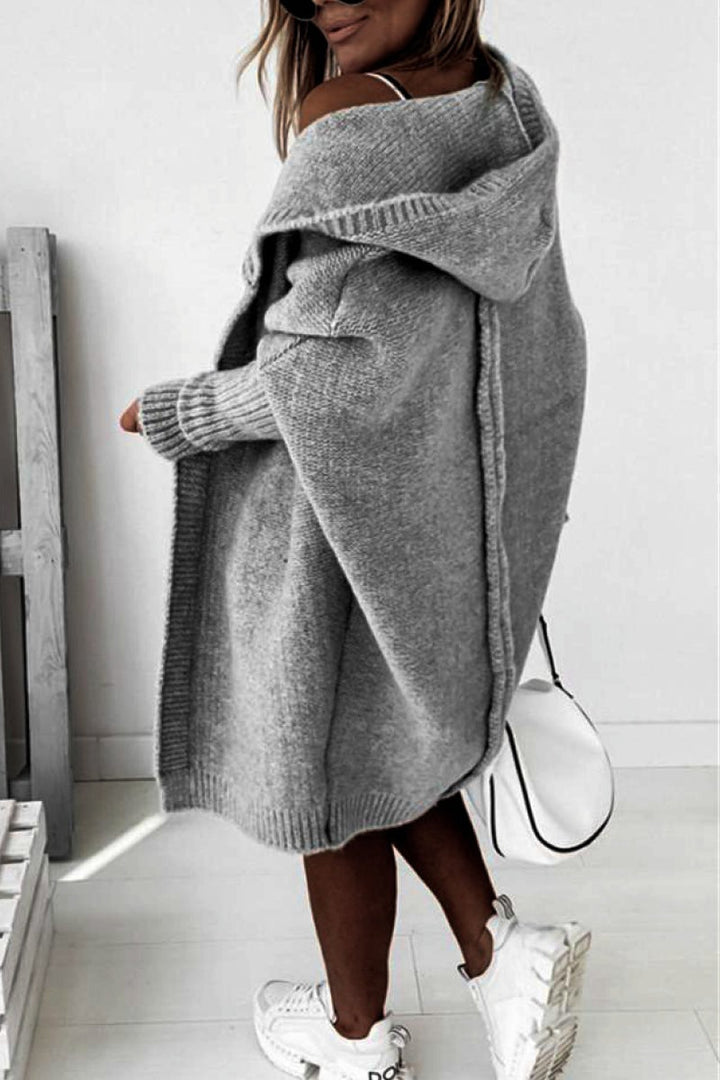 Relaxed fit women's knit hooded cardigan, ideal for cozy autumn layering and everyday wear.