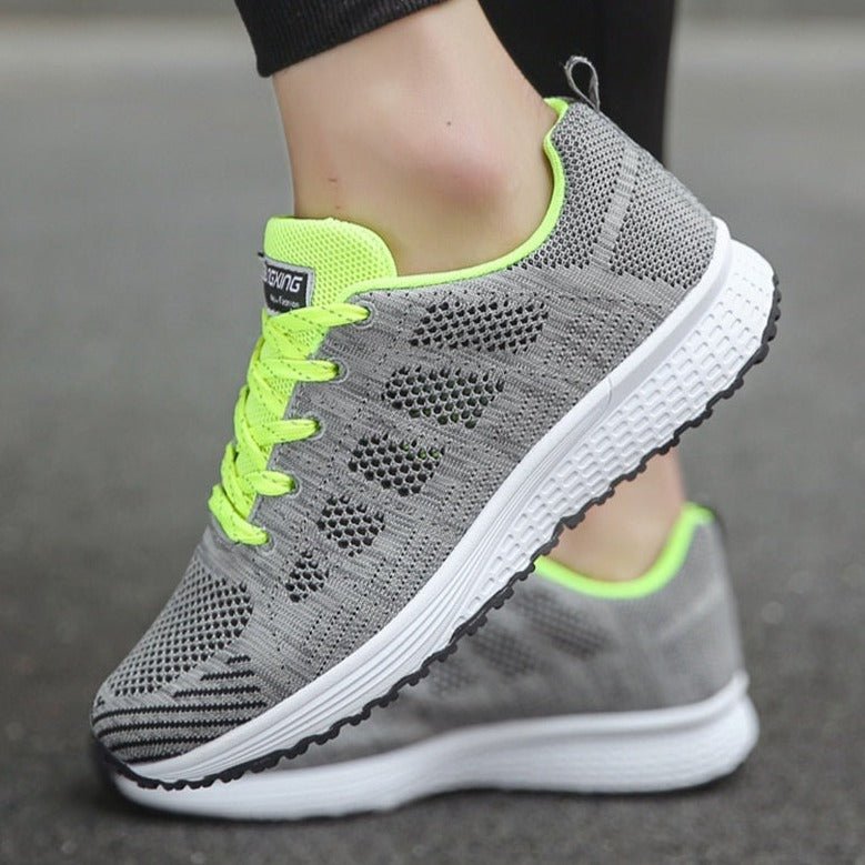 Front view of women's orthopedic comfort sneakers, with detailed lace-up closure & secure fit.