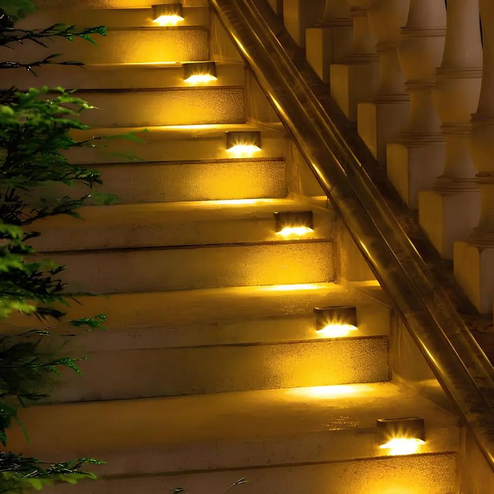 Auto dusk-to-dawn outdoor solar step lights, warm LED for safety.