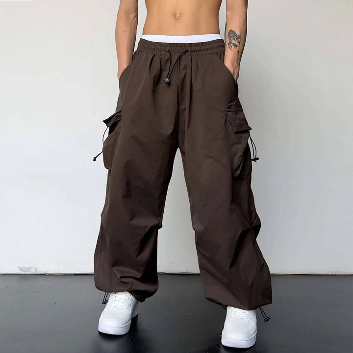 Comfortable polyester cargo joggers, relaxed fit for men & women, essential for modern casual style.