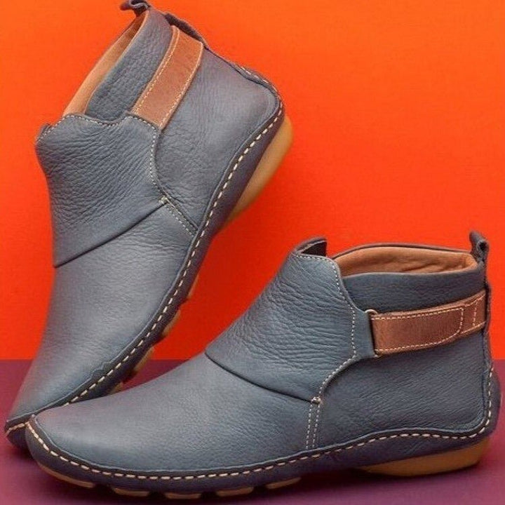 Comfortable women's ankle boots, versatile for everyday wear. Features an adjustable strap for a perfect fit.