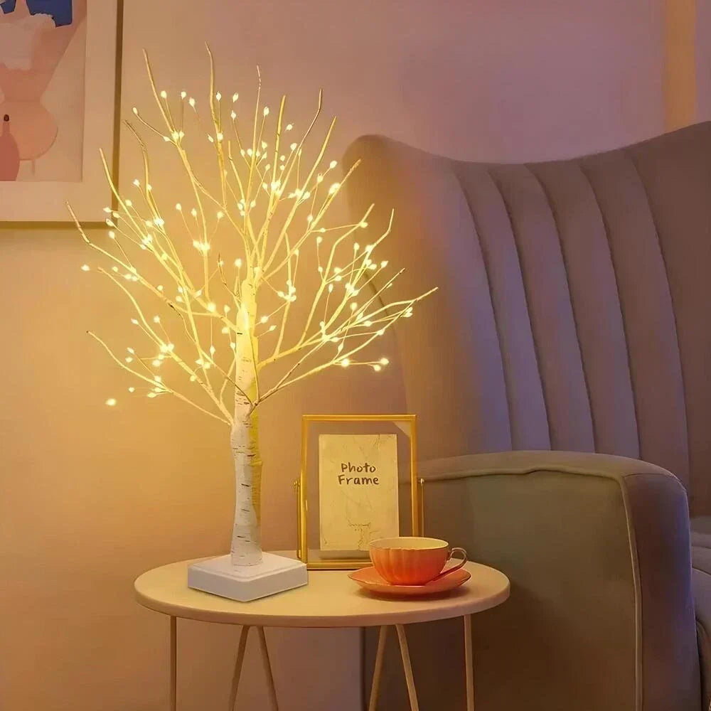 Artistic LED bonsai birch tree lamp, emitting warm white light; a chic decorative piece for home or office.