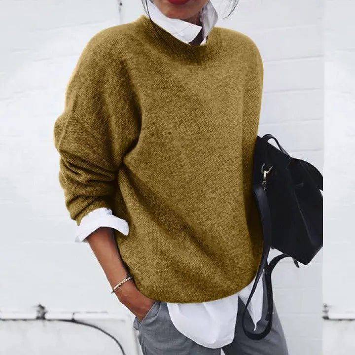 Women's relaxed fit crew neck knit sweater in soft fabric, perfect for effortless casual or chic office wear.