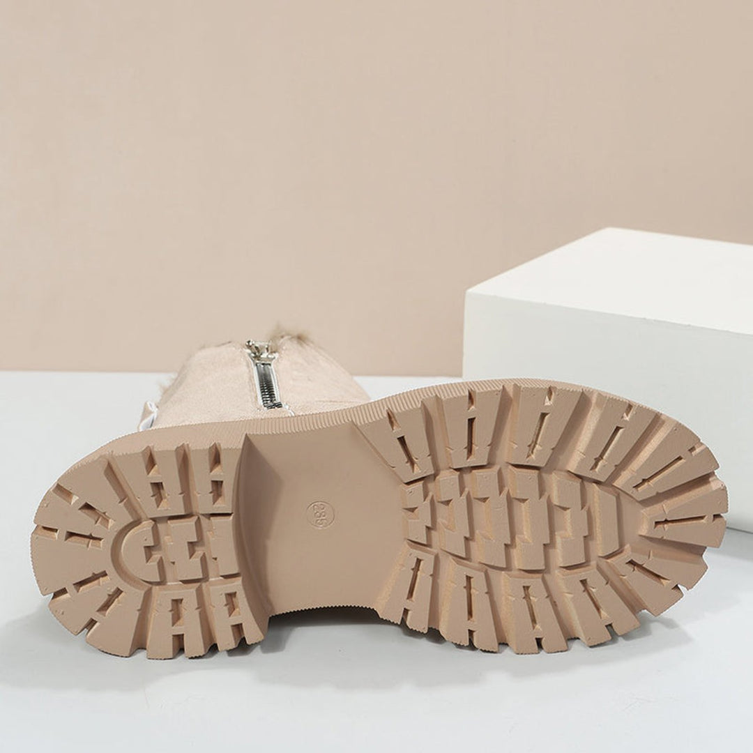 Fashionable women's warm winter ankle boots, easy slip-on style for cozy footwear.