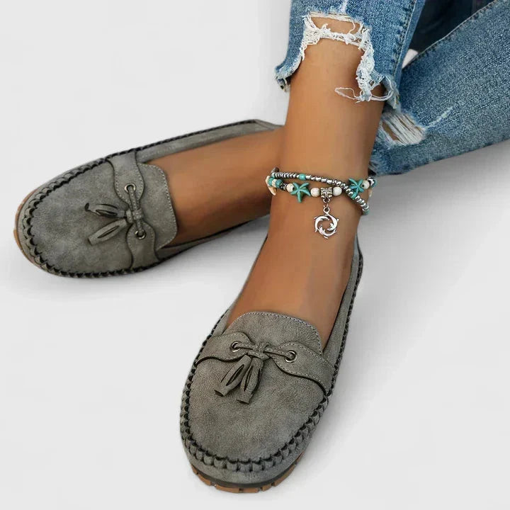 Women's comfortable flat loafers with an elegant bow detail. Easy slip-on everyday shoes for walking & office.