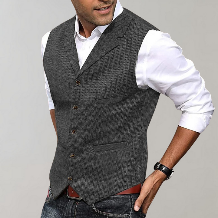 Sophisticated men's v-neck herringbone vest. Ideal for business, weddings, or smart casual outfits.