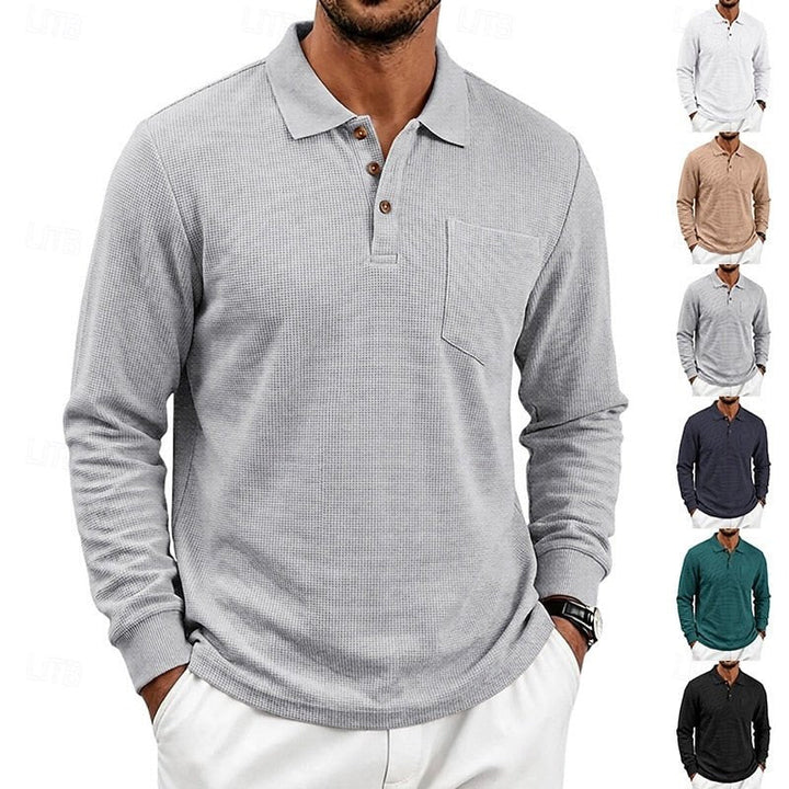 Man in a stylish textured long-sleeve polo shirt. Effortless smart-casual wear for refined spring/fall fashion.