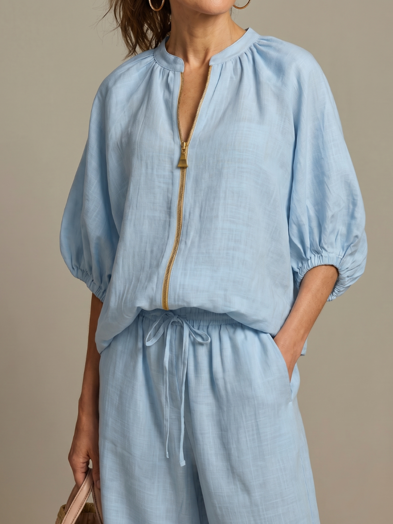 Versatile women's set: zip-front top & wide-leg pants for relaxed everyday elegance.