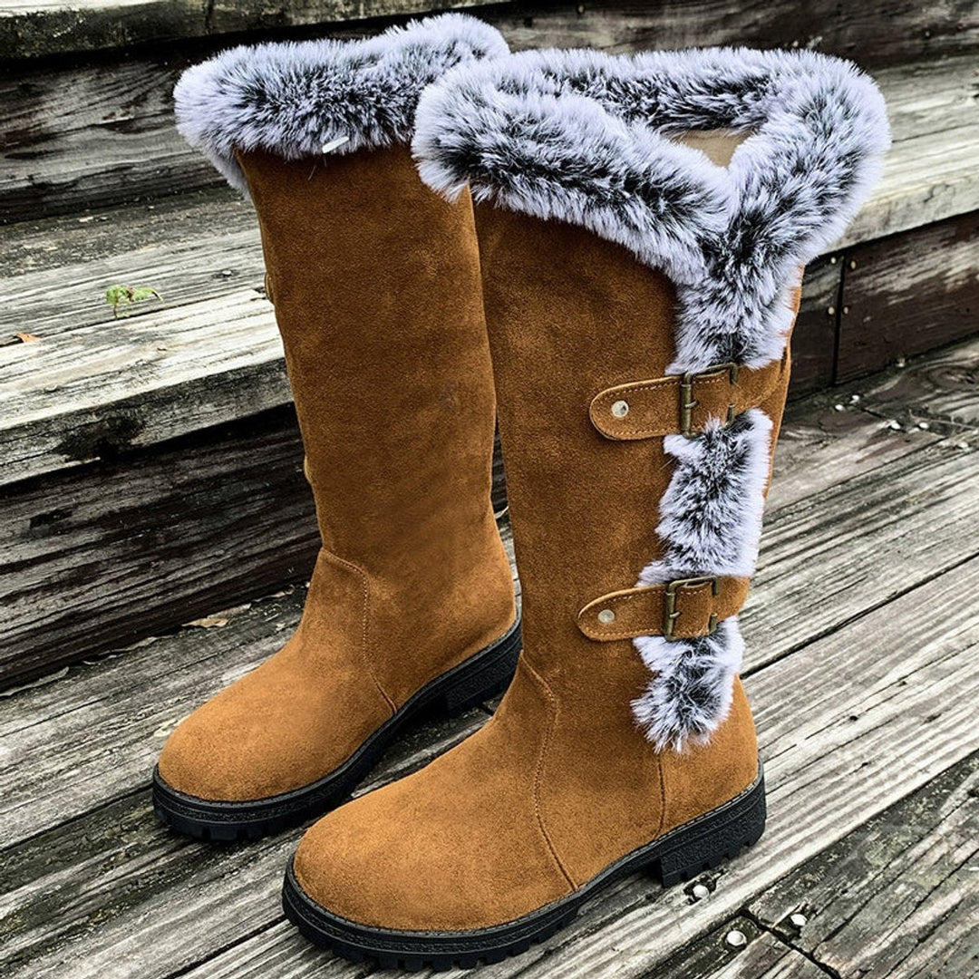 Chic women's tall winter boots with soft fur trim and statement buckle accents, very comfortable.