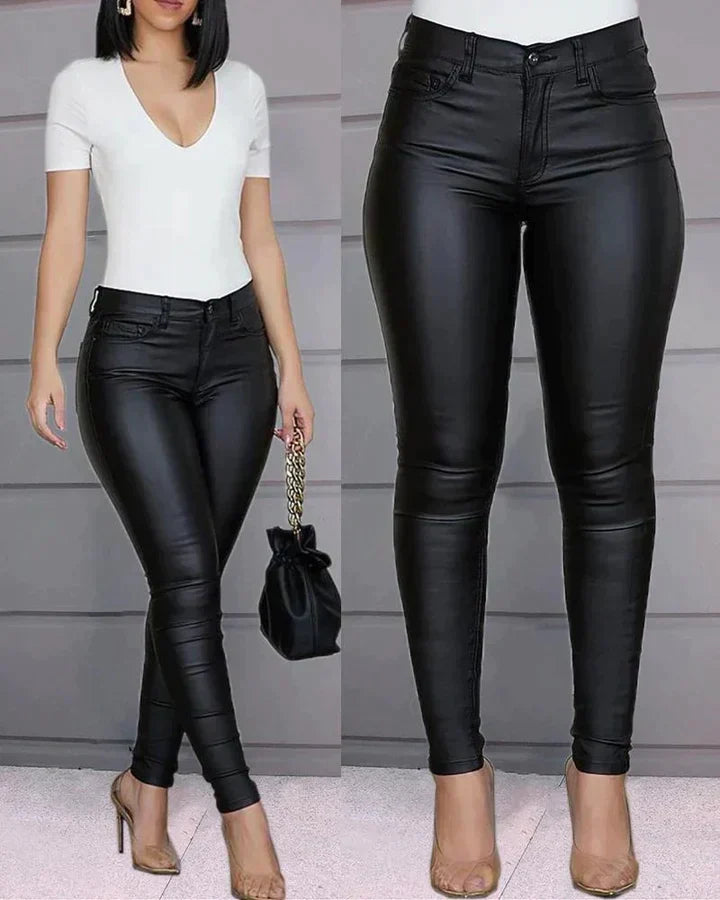 Women's sleek black stretch slim-fit pants, high-waisted for comfort and versatile fashion. Ideal for casual or evening.