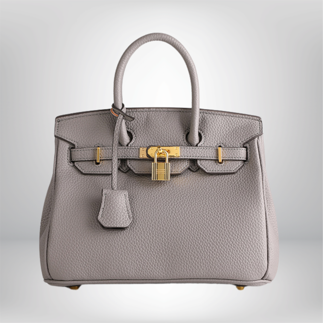 Premium women's handbag: embossed leather texture and exquisite gold embellishments.