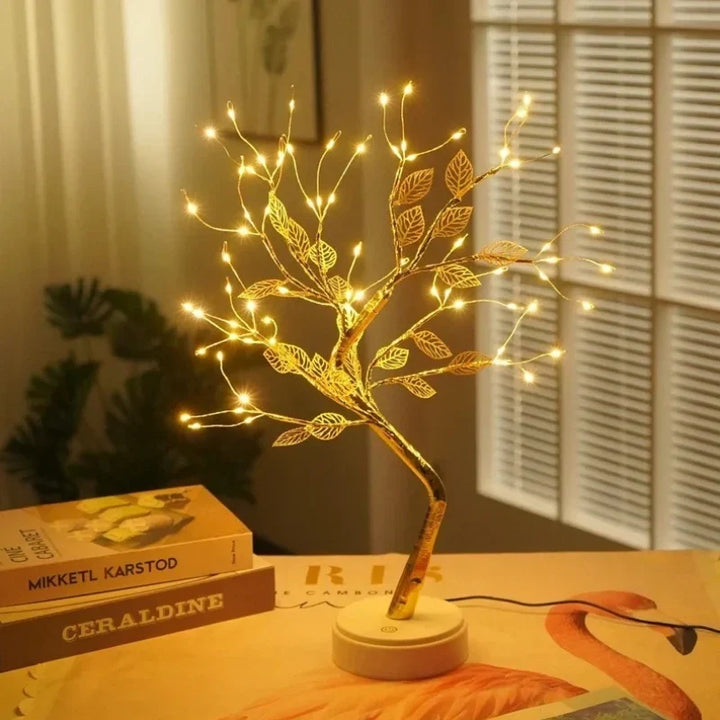 Close-up of a detailed LED golden leaf bonsai tree lamp, showcasing its intricate design and soft warm white glow.