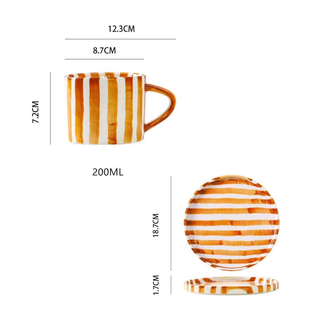 RetroChic ceramic coffee cup and saucer set, hand-painted for a vintage style kitchen decor.
