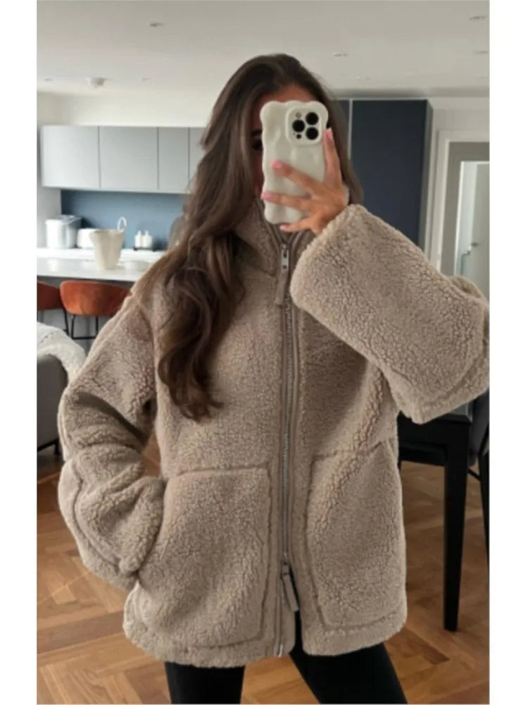 Women's cozy teddy jacket, soft and warm for ultimate winter comfort. Perfect stylish outerwear for cold weather.