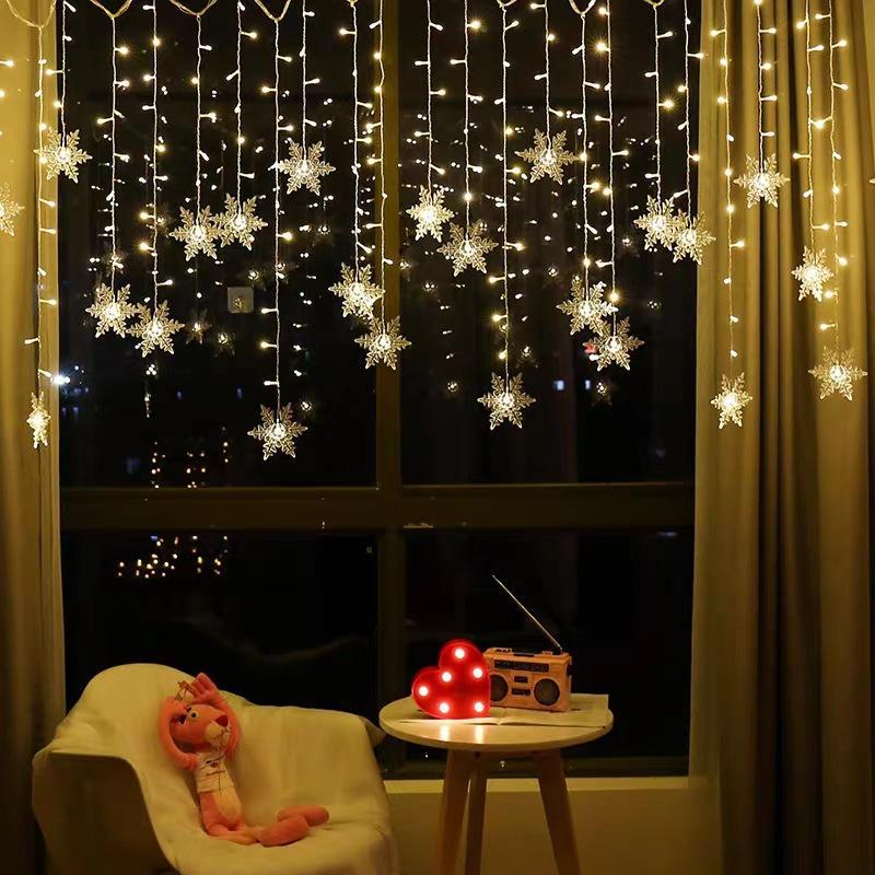 Charming LED snowflake string lights enhancing winter holiday home and party decor.