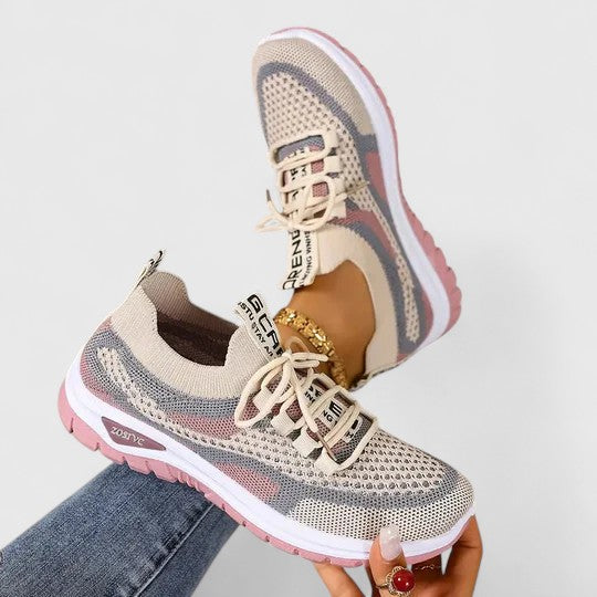 Lace-up women's lightweight sneakers, designed for comfort and support during active everyday wear.