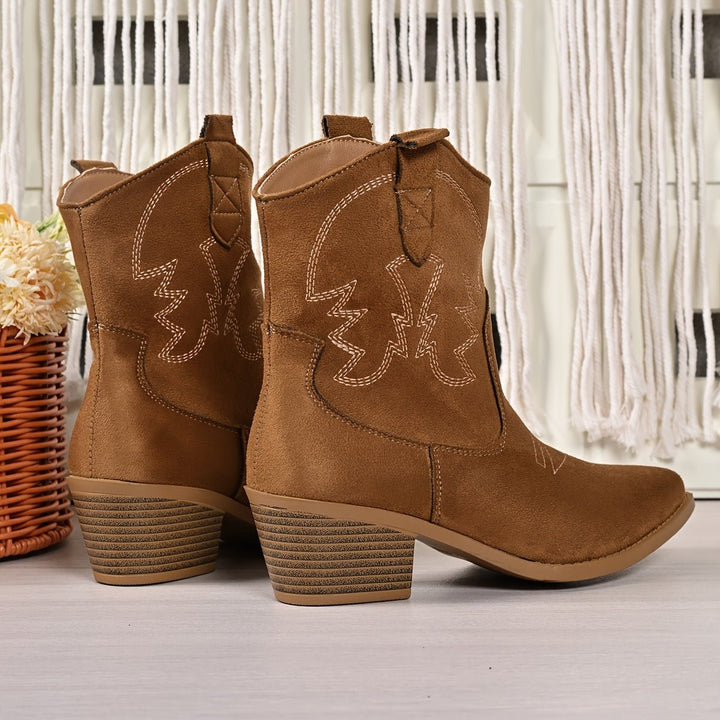 Stylish women's wide-calf cowboy boots, pointed toe & block heel. Perfect for western fashion & festivals.