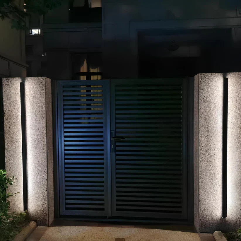 Adjustable, weatherproof modern outdoor LED wall sconce for versatile exterior and facade lighting.