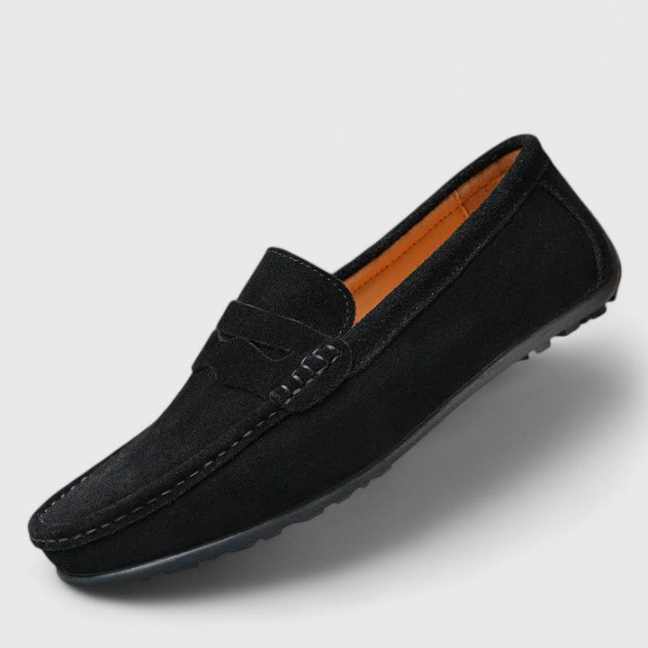 Close-up of handstitched detail on premium men's slip-on comfort loafers.