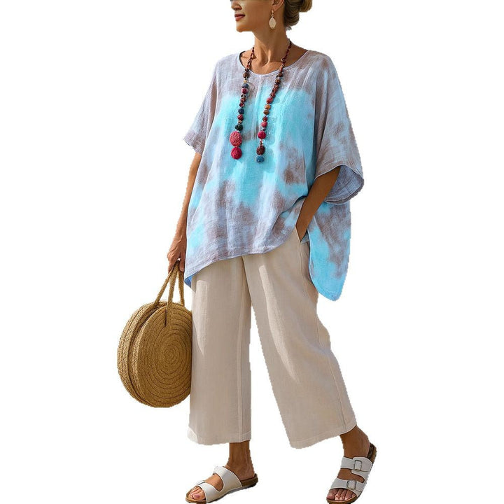 Modern royal blue women's asymmetric tunic, a comfortable, relaxed fit summer top for casual or vacation style.
