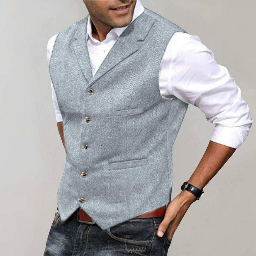 Smart casual men's herringbone button-up vest. Versatile layering piece for a timeless and elegant look.