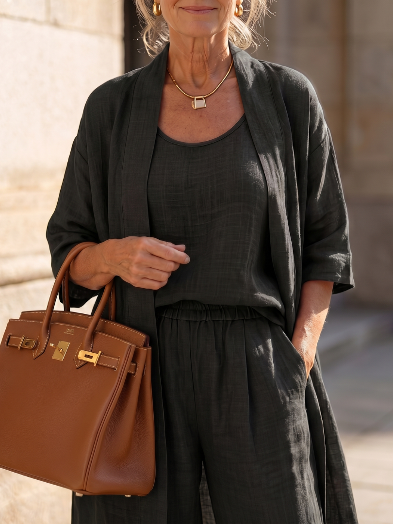 Comfortable women's three-piece outfit for home or casual events, with a loose top and wide-leg pants.