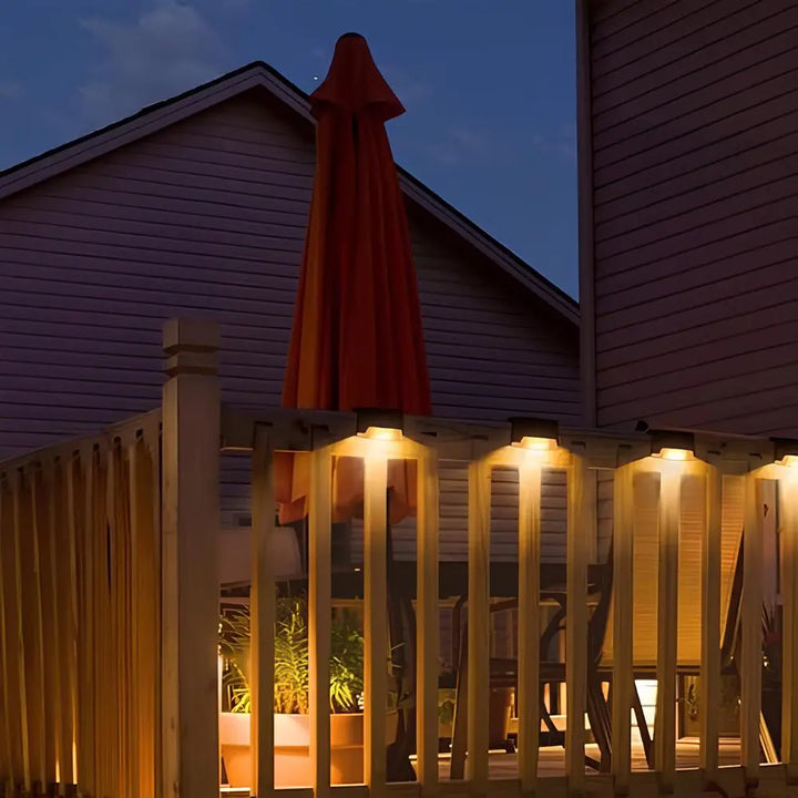 Warm glow solar LED step lights for outdoor garden and patio.