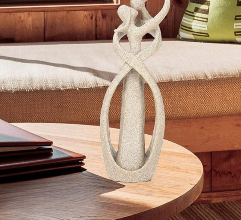 Decorative abstract love figurine, a modern art piece for elegant home and office tabletop decor.