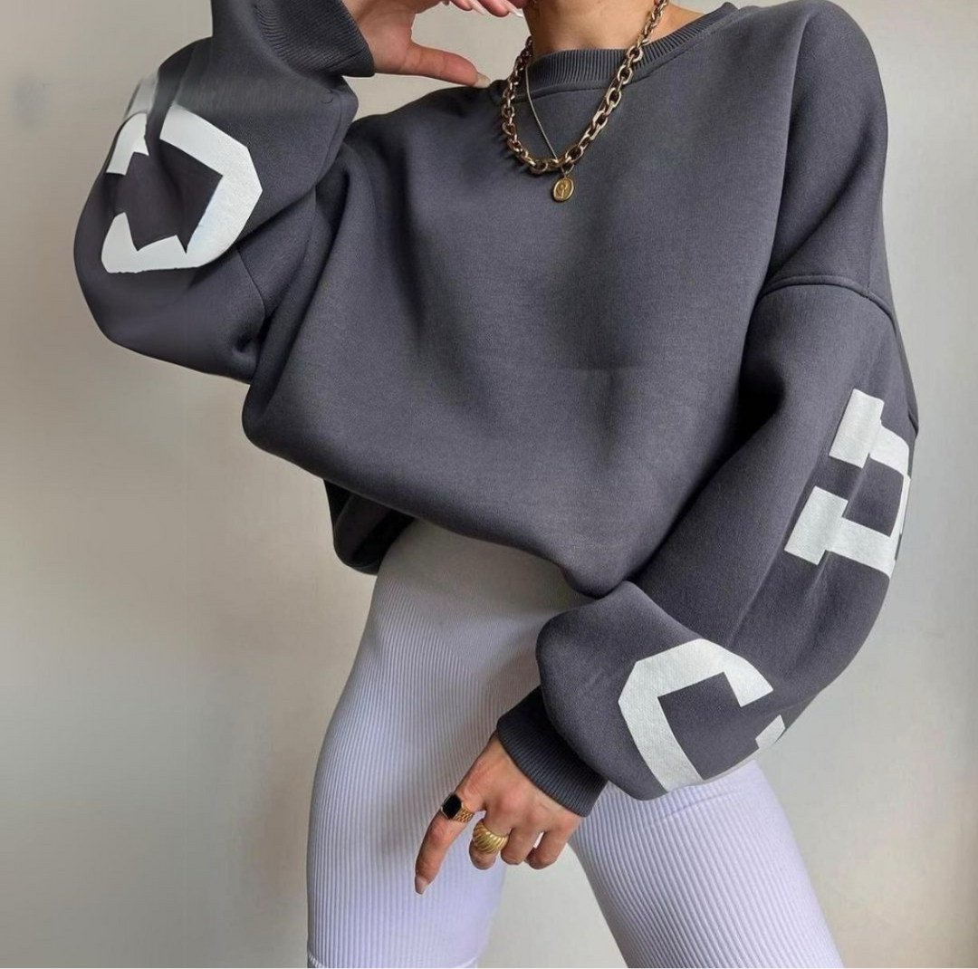 Cozy women's long sleeve sweatshirt, relaxed fit, perfect for ultimate comfort.