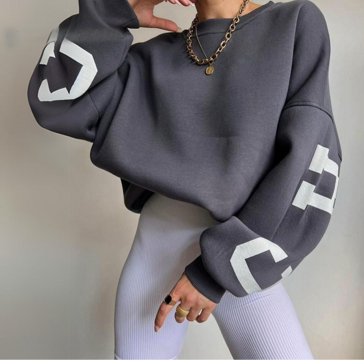 Cozy women's long sleeve sweatshirt, relaxed fit, perfect for ultimate comfort.