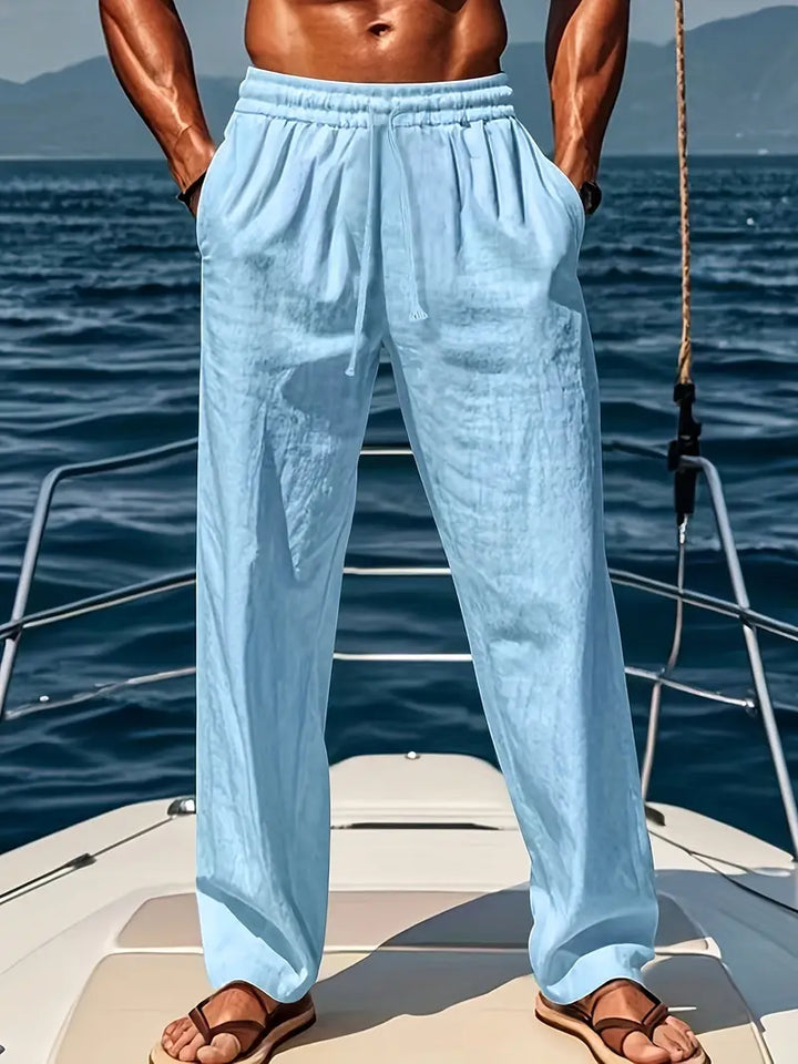 Comfortable men's drawstring pants; loose fit summer trousers in a breathable lightweight fabric for casual fashion.