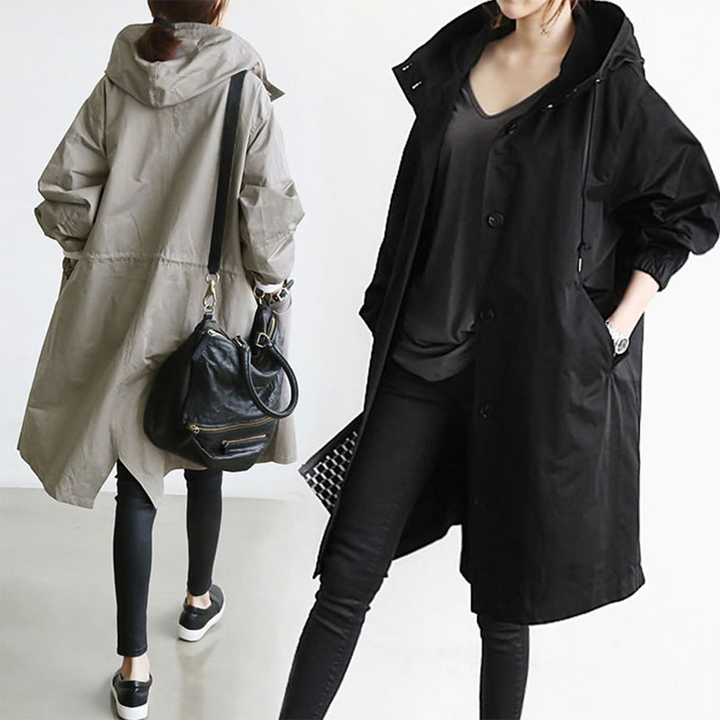 Durable women's long waterproof jacket. Versatile hooded raincoat, suitable for various outdoor activities and travel.