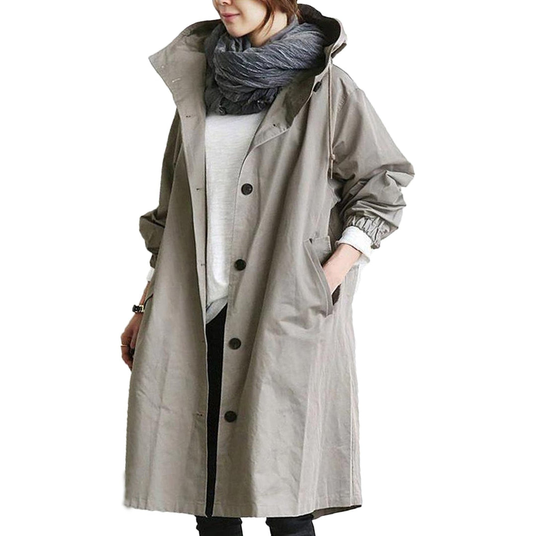 Women's stylish long waterproof jacket, keeping you dry and chic. Elegant all-weather hooded outerwear, durable & functional.