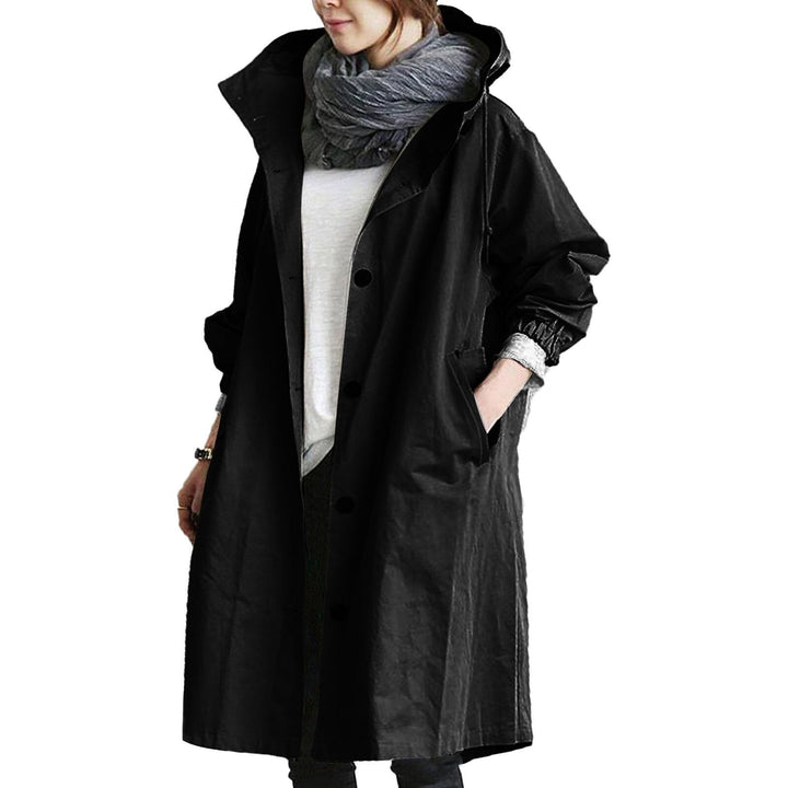 Functional waterproof long coat for women, ideal for travel and commuting. Durable all-weather hooded jacket for protection.