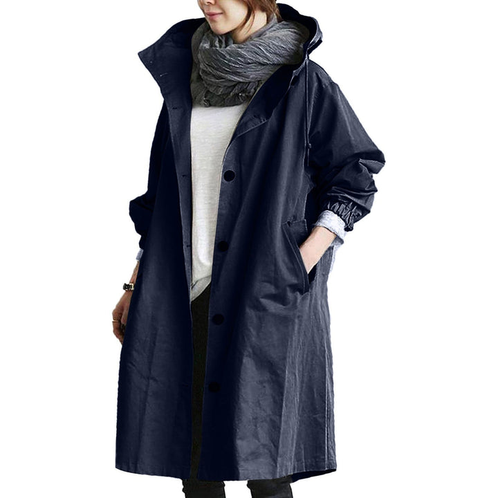 Women's elegant long waterproof raincoat, a must-have for autumn fashion. Stylish hooded jacket for protection against rain.