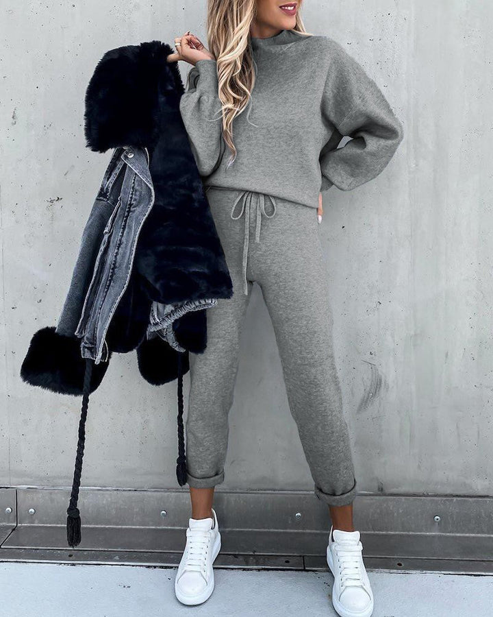 Trendy women's high collar 2-piece loungewear set with elastic waist pants for chic everyday fashion.