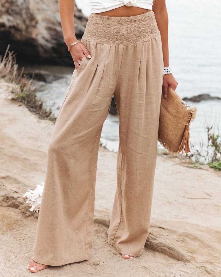 Women's flowy wide leg beach pants for summer vacation, coastal style, and comfortable loungewear.
