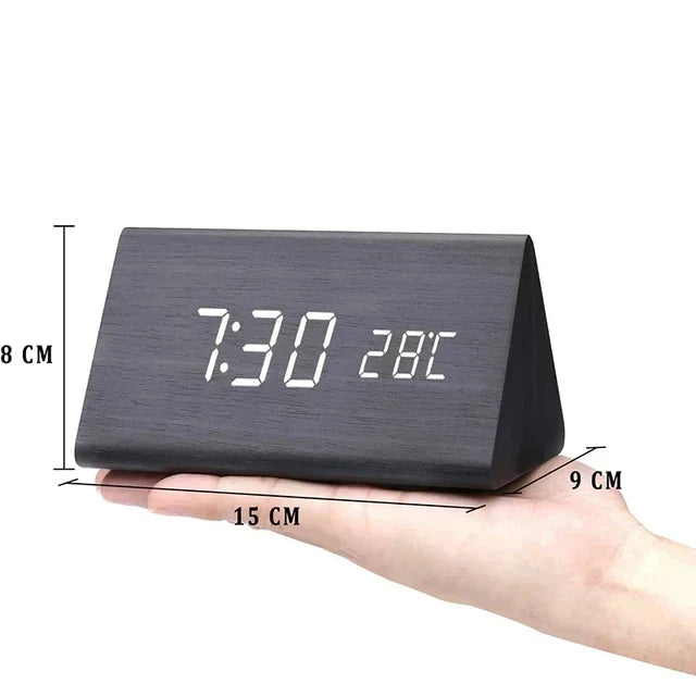 Contemporary digital alarm clock with white LED digits and voice control functions.