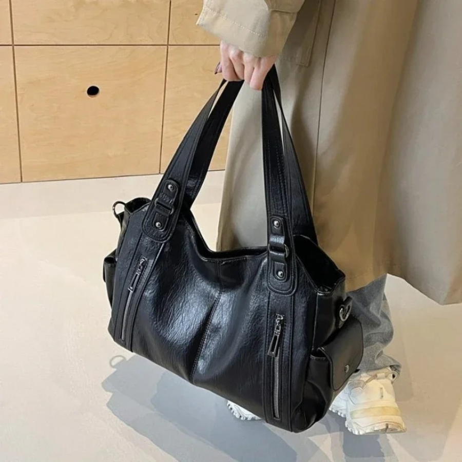 Women's faux leather shoulder duffle bag, chic & spacious for everyday use, travel, or work.