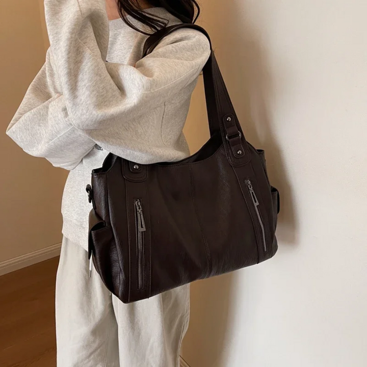 Stylish vegan leather women's shoulder duffle, perfect everyday handbag, travel accessory, or work bag.