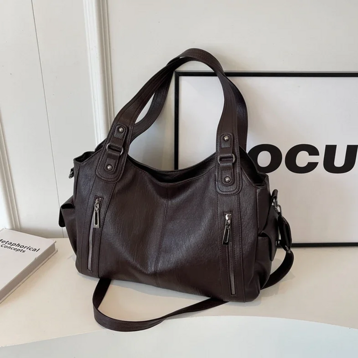 Chic women's faux leather shoulder duffle bag, a versatile everyday handbag & travel accessory for women.
