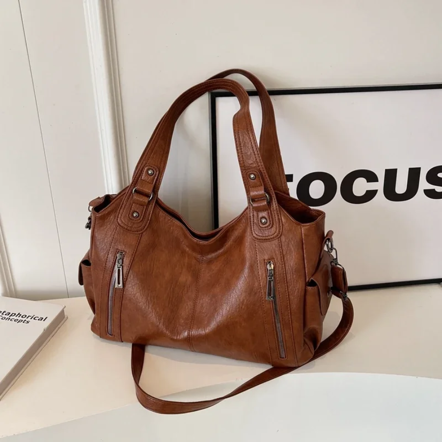 Versatile women's faux leather shoulder duffle, an essential everyday handbag, work bag & travel accessory.