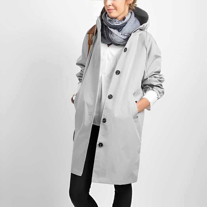 Durable women's hooded rain jacket, lightweight & waterproof, essential outdoor gear for active women.