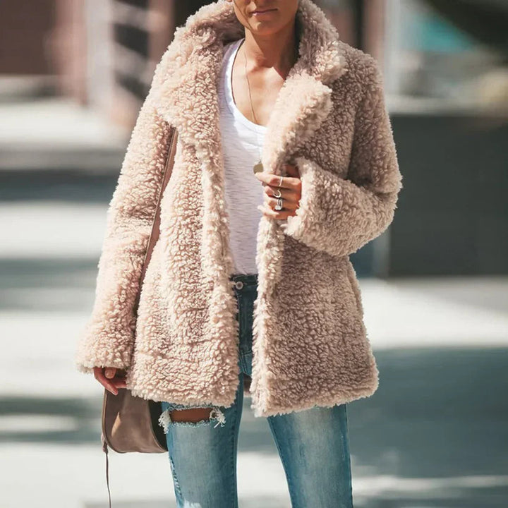 Versatile women's plush textured coat, perfect for layering in fall fashion or warm winter style.