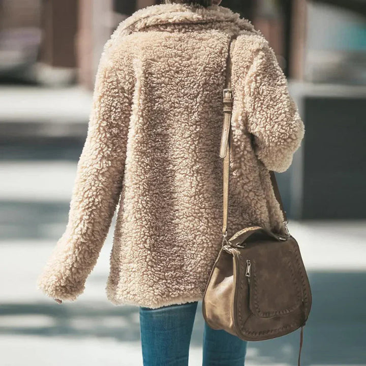 Cozy women's textured long-sleeve coat, comfortable and relaxed fit outerwear for winter fashion.