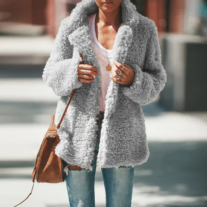 Stylish women's plush coat with textured finish, a versatile layering jacket for cozy fall & winter looks.