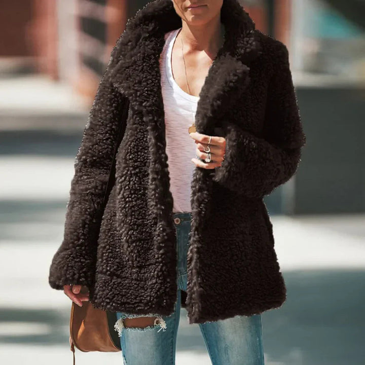 Comfortable women's plush textured coat, a versatile long-sleeve layering piece for fall/winter outerwear.